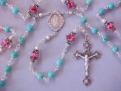 Genuine turquoise gemstone rosary with hand made red glass with pink roses, all sterling wire wrapped construction, sterling silver crucifix and Our Lady of Guadalupe center medal