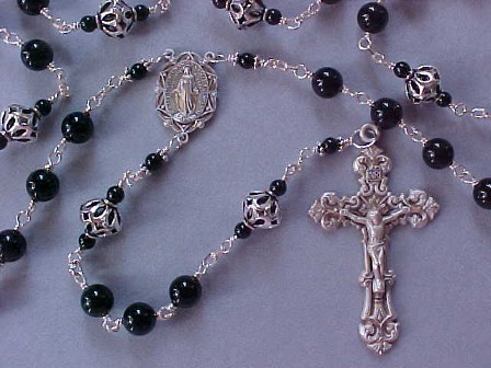 Men's rosary with Black Onyx or Black Tourmaline, sterling silver cut out beads, all sterling wire wrapped construction, sterling crucifix and center