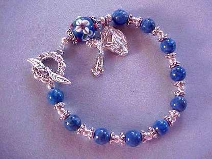 rosary bracelet with denim lapis and floral lampworked glass
