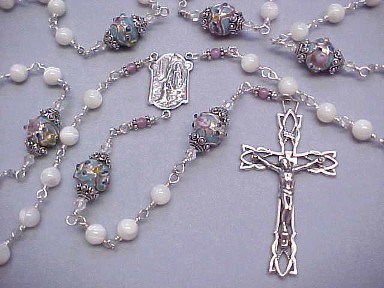 handmade wire wrapped Our Lady of Lourdes rosary with Mother of Pearl, blue lampworked glass with pink roses and sterling silver wire wrapped construction