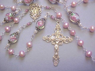 handmade sterling silver wire wrapped rosary with rose color freshwater pearls, lampworked glass and deluxe floral crucifix and center