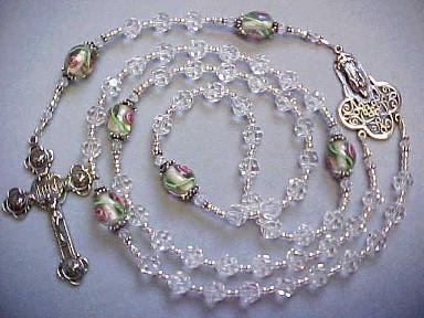 Sterling Silver Our Lady of Guadalupe rosary with Swarovski crystal, lampworked glass and hand cast sterling silver Our Lady of Guadalupe center and 4 Roses crucifix Sterling Silver Our Lady of Guadalupe rosary with Swarovski crystal, lampworked glass and hand cast sterling silver Our Lady of Guadalupe center and 4 Roses crucifix