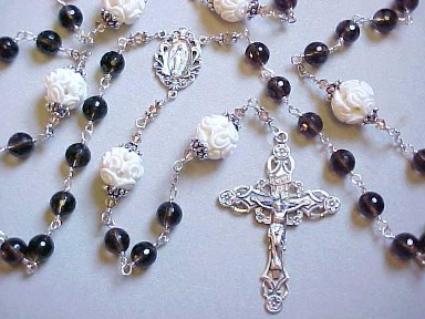 Smoky Quartz gemstone rosary with carved bone our Fathers, all sterling wire wrapped construction, ornate sterling silver crucifix and center medal Smoky Quartz gemstone rosary with carved bone our Fathers, all sterling wire wrapped construction, ornate sterling silver crucifix and center medal