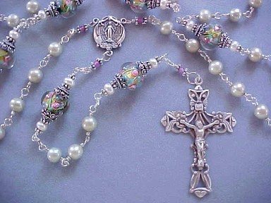 Sterling Silver wire wrapped rosary with pistachio pearls and lampworked glass.